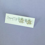 Load image into Gallery viewer, Bow Stud Earrings in Shimmery Pearl
