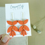Load image into Gallery viewer, 3-Tiered Leather Textured Earrings in Pumpkin
