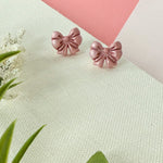 Load image into Gallery viewer, Bow Studs in Shimmery Pink (child)
